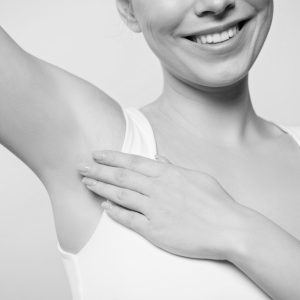 partial-view-of-smiling-woman-applying-deodorant-o-2022-12-16-20-45-21-utc-min